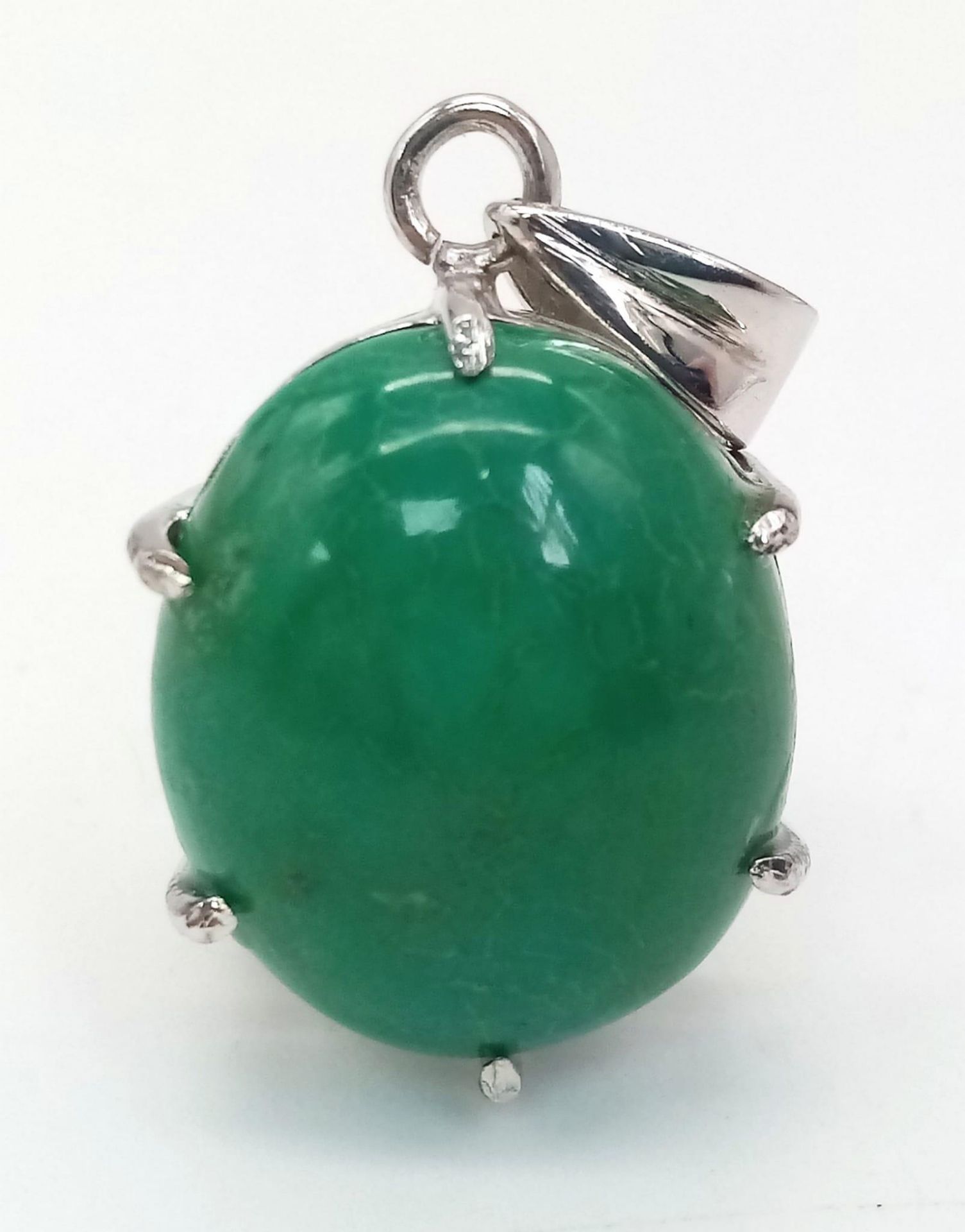 An Oval Turquoise Cabochon Pendant. Set in 925 Sterling Silver. 7.80g. 4cm