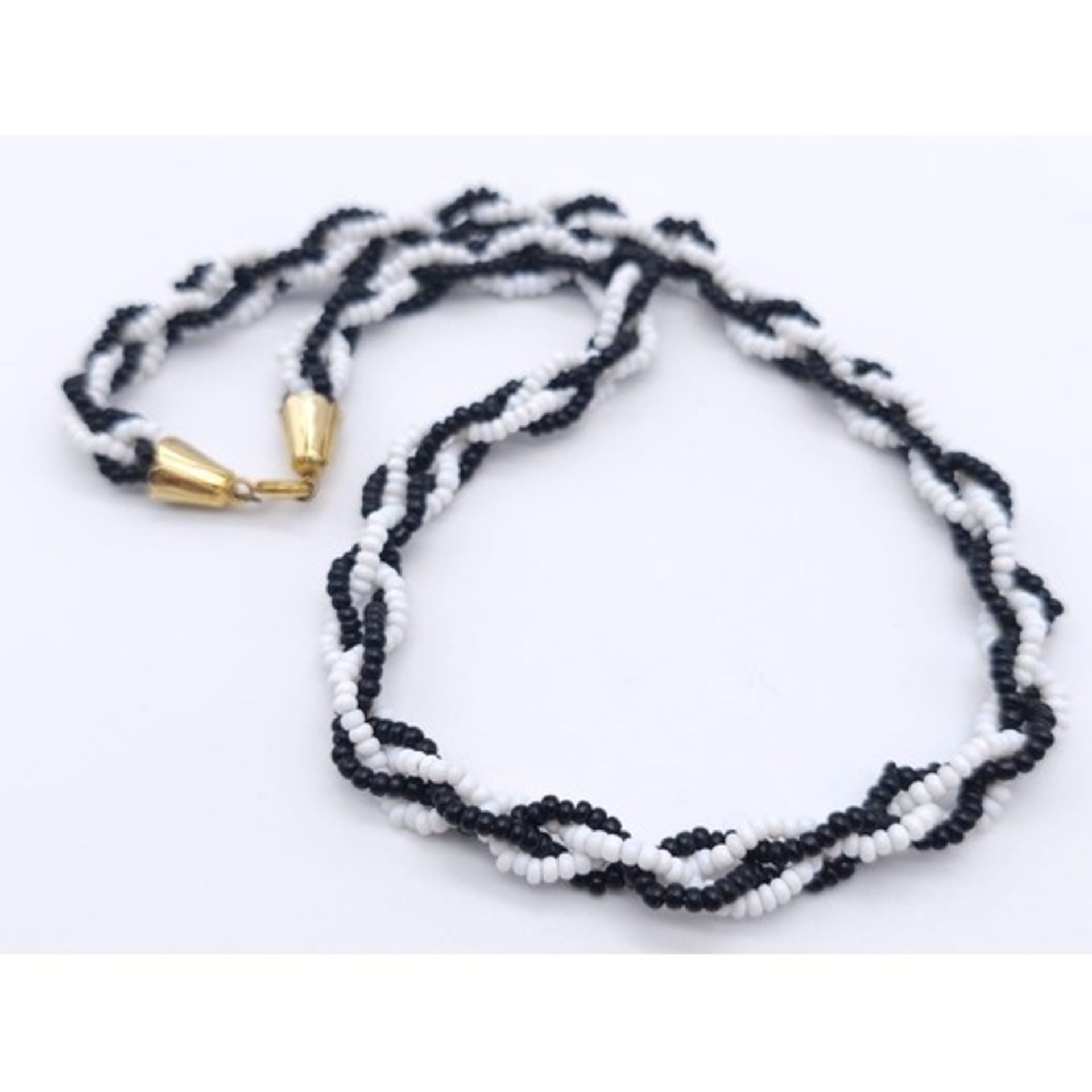 Parcel of two vintage necklaces. Featuring one Black & White Twisted Small Bead Necklace with Gold - Image 2 of 7