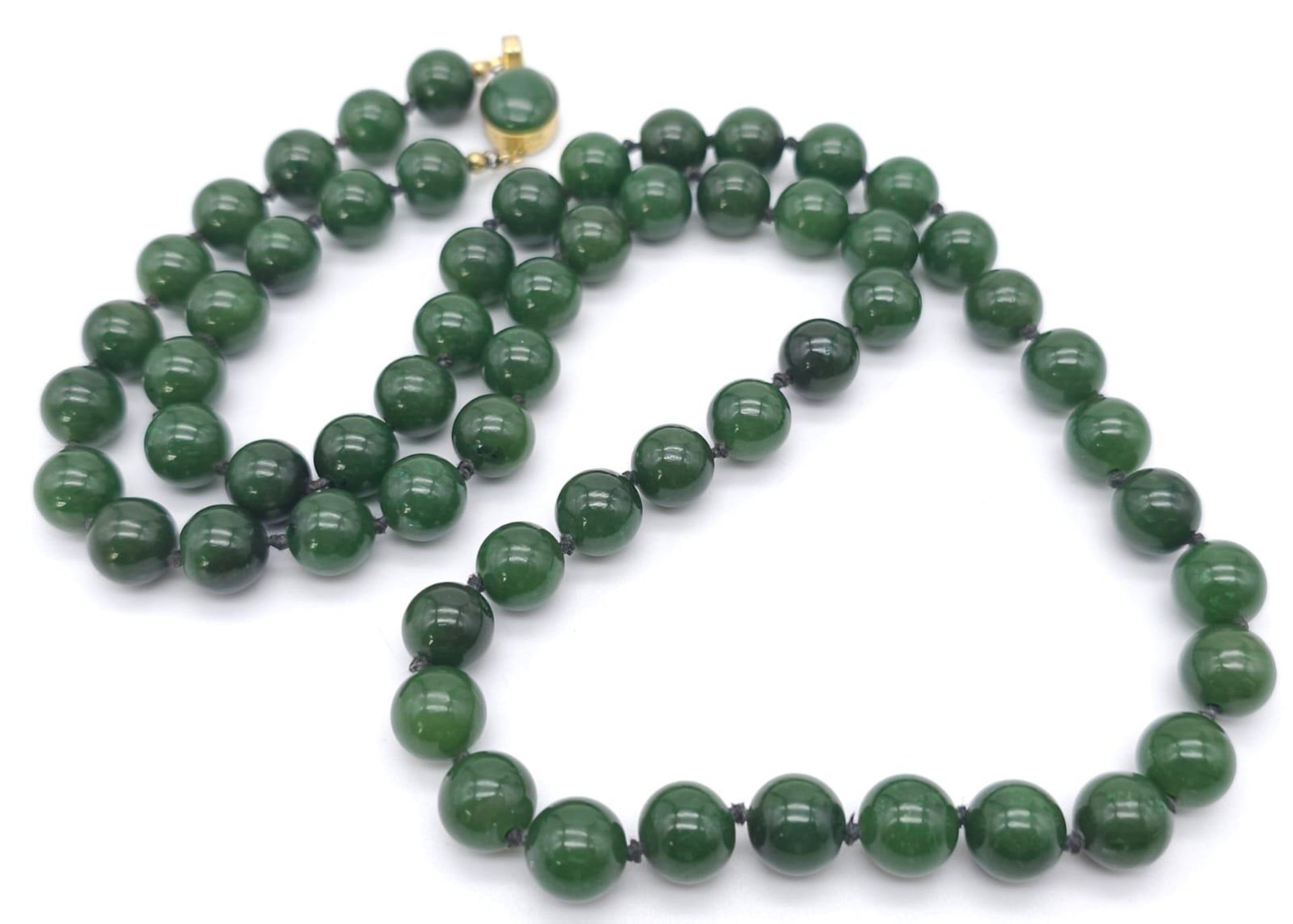 Long Green Jade Beaded Necklace. Measuring 68cm in length, this necklace is filled with rich green