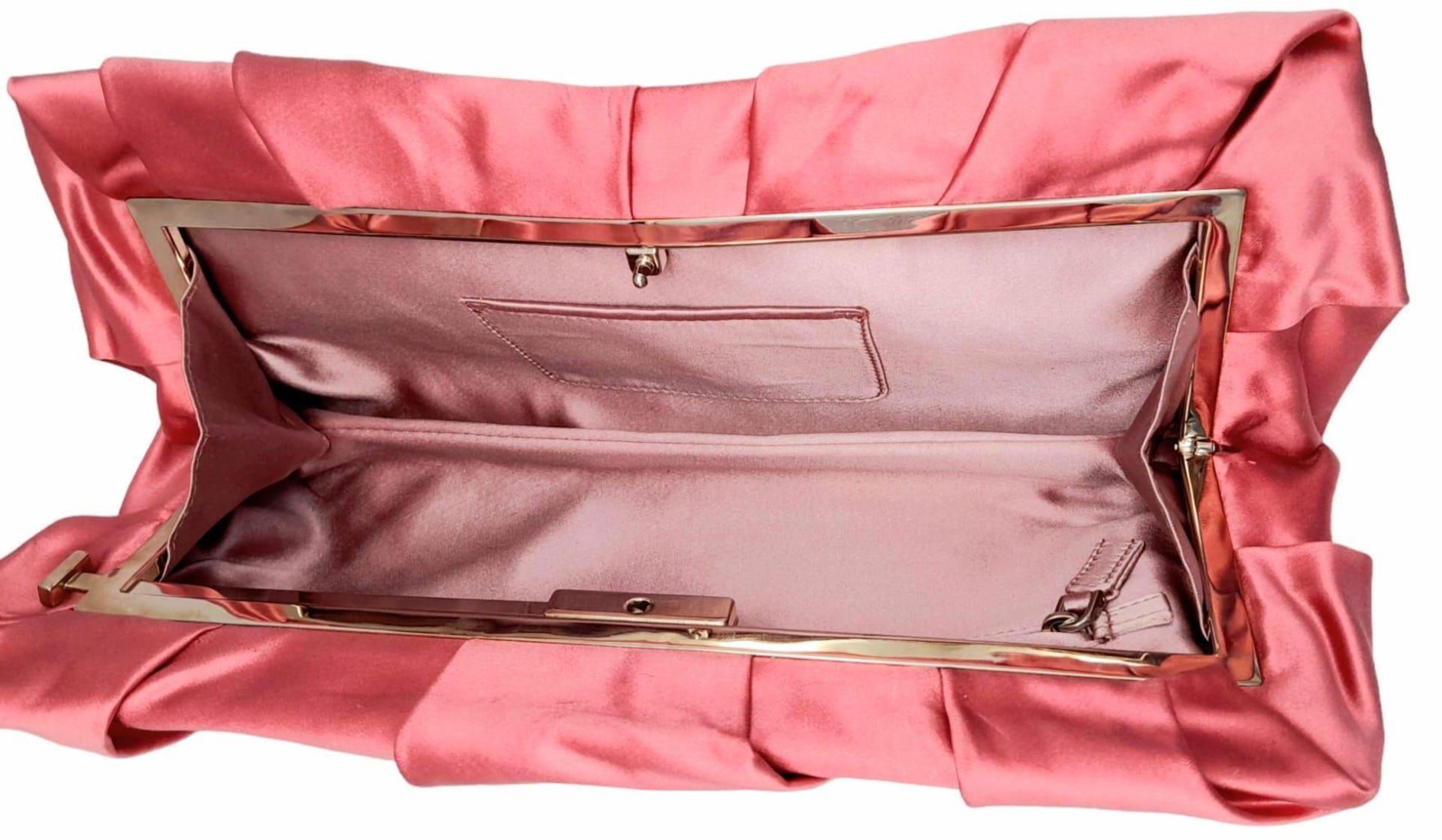 A Prada Pink Pleated Clutch Bag. Satin exterior with silver-toned hardware and press lock closure to - Bild 6 aus 9