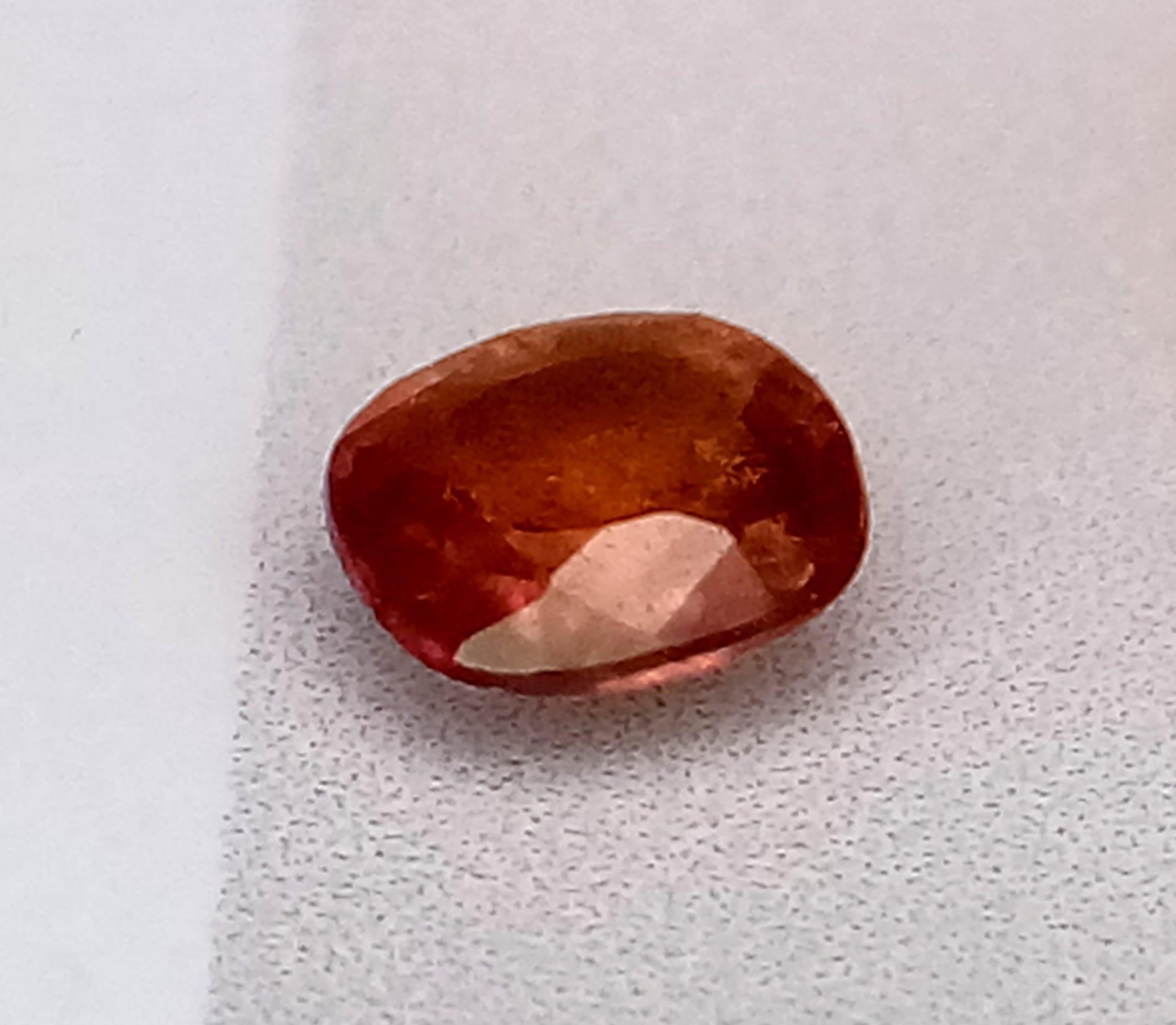 A 0.28ct Orange Sapphire Gemstone - With GFCO certificate. Comes in a sealed package.