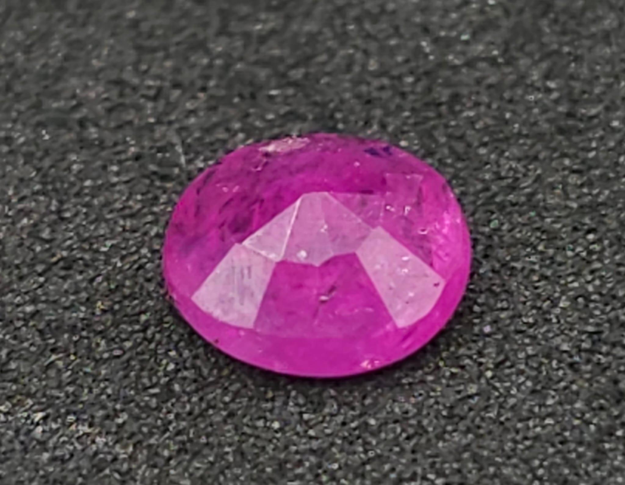 A 0.73ct Burmese Ruby Gemstone. Comes with a GFCO certificate and a presentation case. - Image 2 of 5