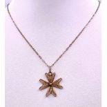 A 925 gilded silver Filigree Maltese cross pendant on silver chain. Total weight 2G. Total length