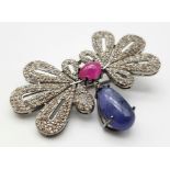 A Tanzanite, Ruby and Diamond Butterfly Brooch. 12.7ct tanzanite, 3.55ct ruby, 5.40ctw diamonds. 6.