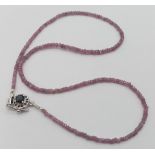 A Single Strand Pink Sapphire Necklace with Ruby and 925 Silver Clasp. 42cm length.