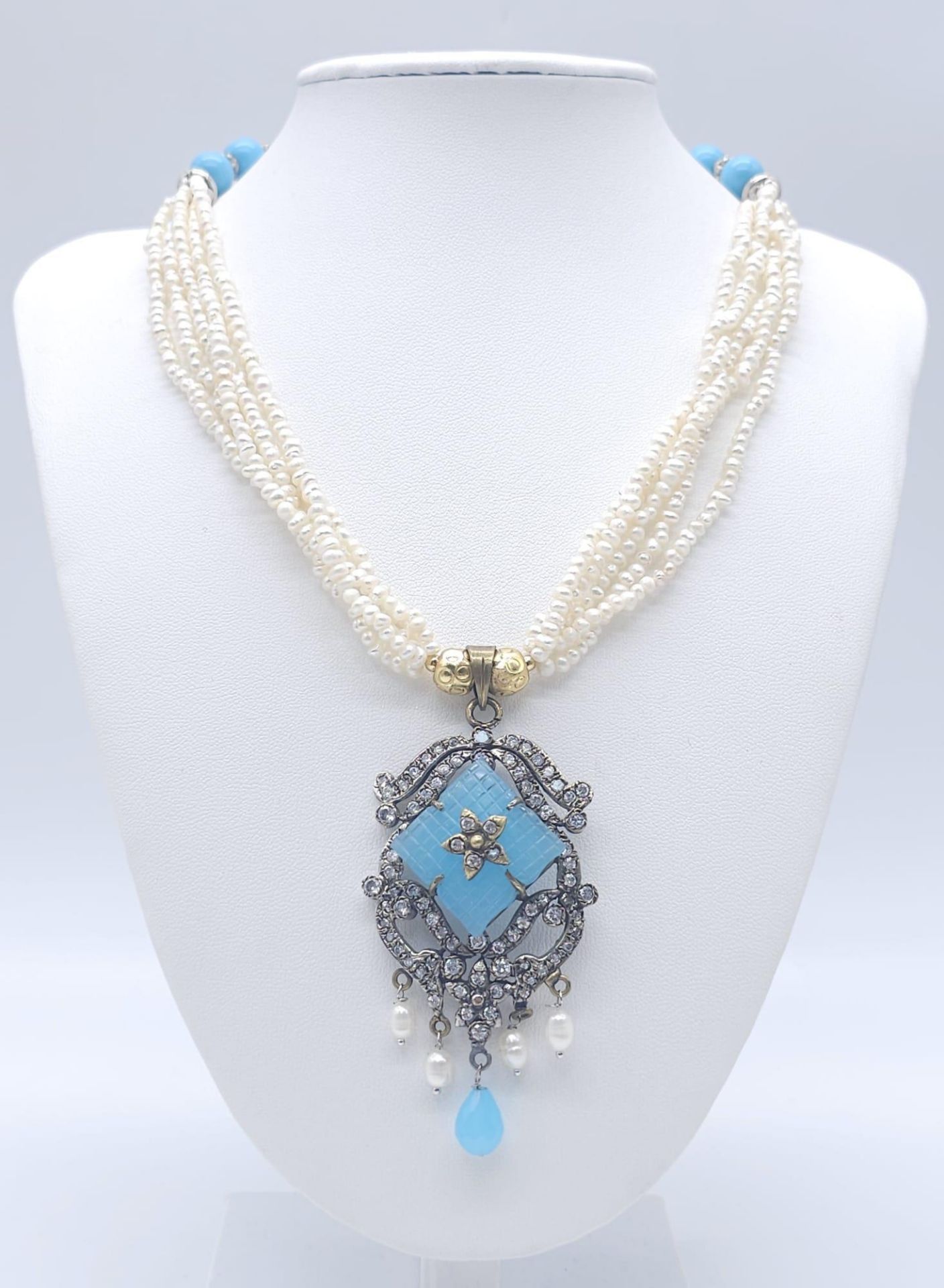 A Vintage Chalcedony and Four Strand Seed Pearl Necklace. With an art deco style drop pendant.