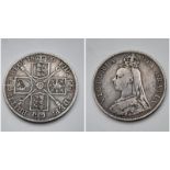 An 1890 Queen Victoria Silver Florin Coin. VF grade but please see photos.