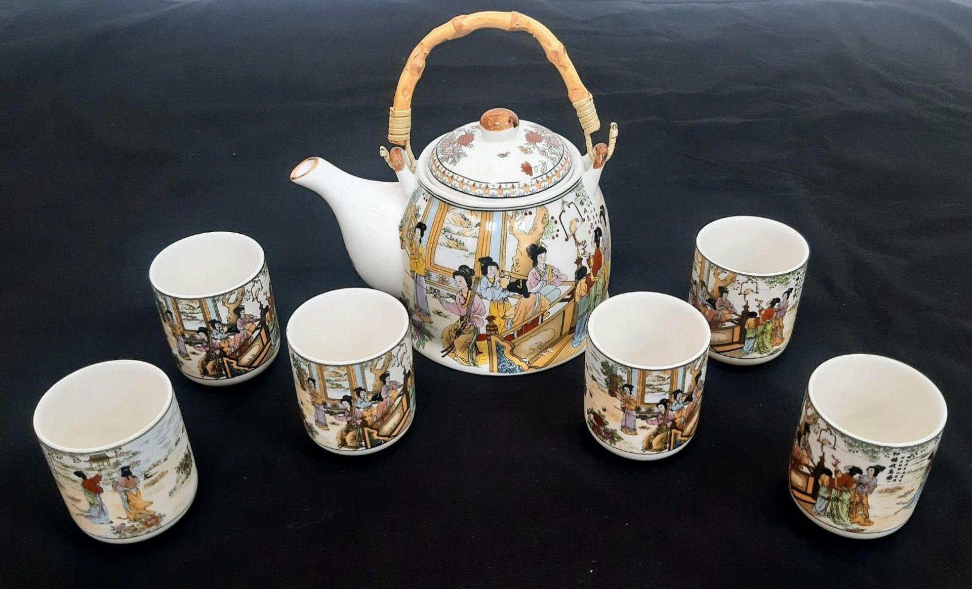A Chinese Tea Set with 6 cups. Comprising of a Teapot with bamboo handle and six Chinese Tea Cups. - Bild 2 aus 14