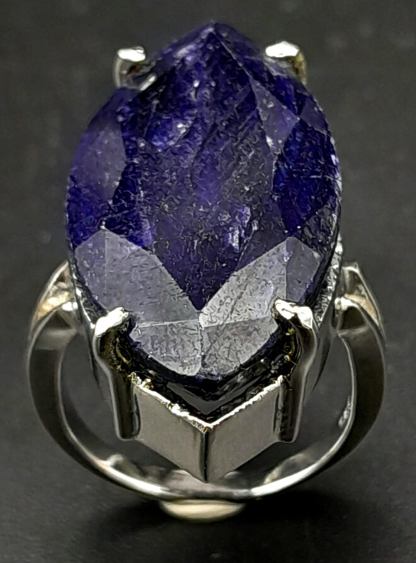 A Marquise Cut Blue Sapphire 925 Silver Ring. Size M. Sapphire - 60ct. 12.70g total weight. Comes