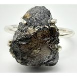 A 925 silver Rough Amethyst Ring. Total weight 5.3G. Size O. Come with a presentation box.