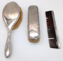 An Antique Sterling Silver Hair, Clothes Brush and Comb Set. Hallmarks for Birmingham 1919. Makers