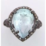 An Aquamarine and Diamond 925 Silver Ring. Central 8ct pear-shaped aquamarine with 0.50ctw of