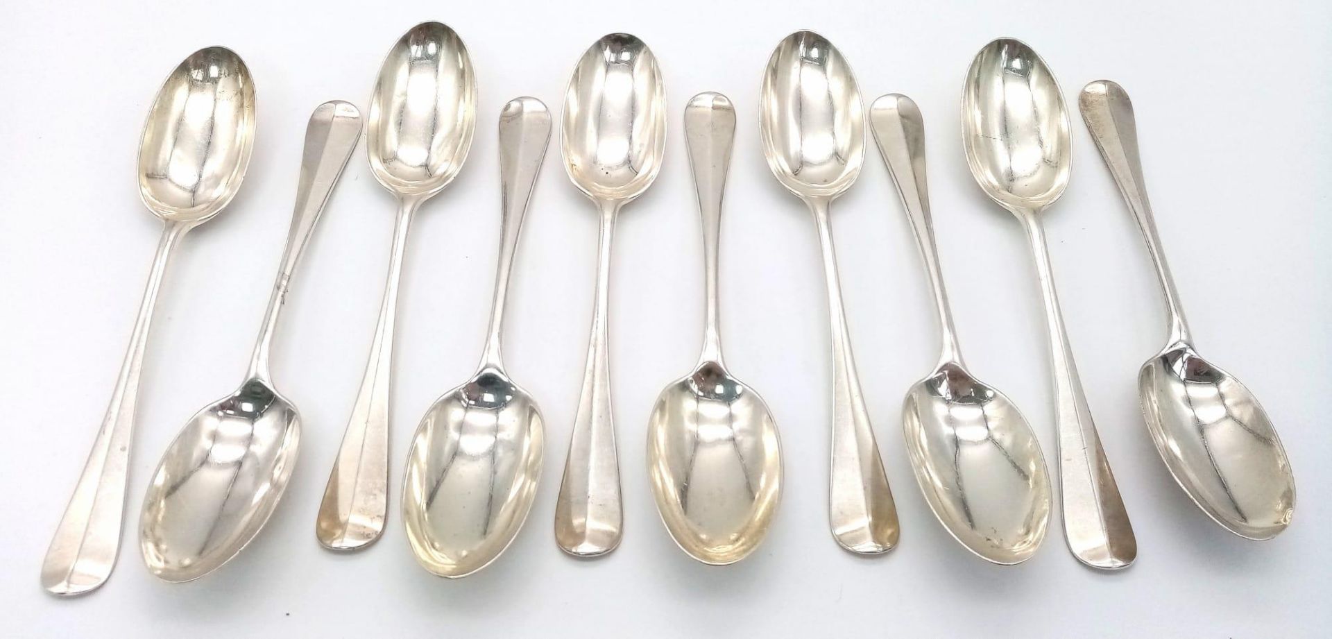 Ten Mid-Size Sterling Silver Antique Spoons. 17cm. 546g total weight. Hallmarks for London 1924.