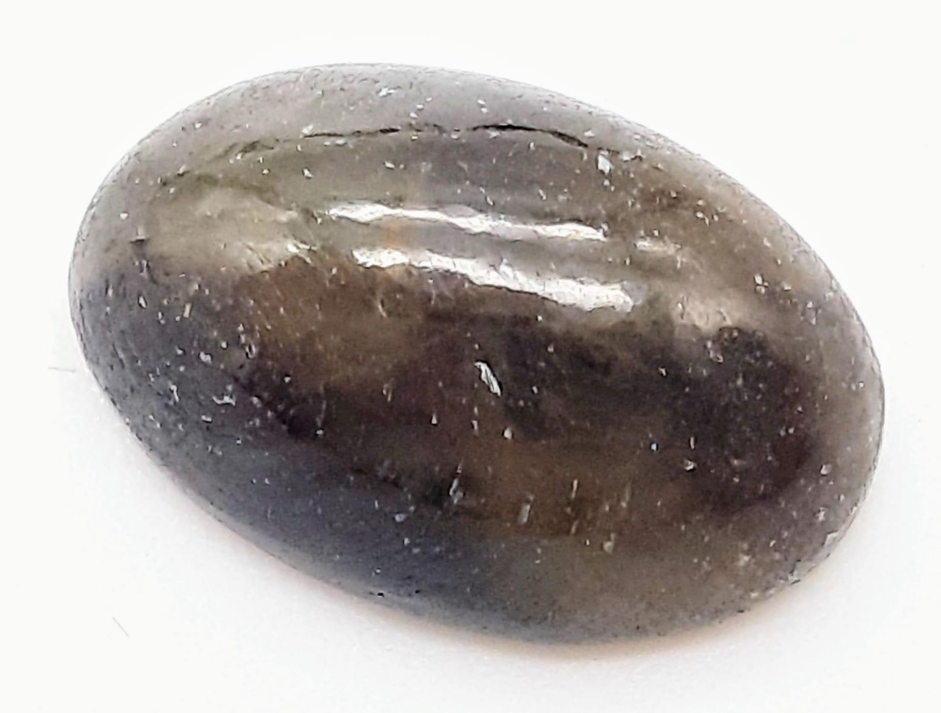 A 10.10ct Oval Cut Cabochon Untreated African Sapphire. GLI certificate. Ref: CV12