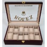 A 12 Watch Display Case - Perfect for Rolex Watches. Polished veneer exterior. Plush interior. 26