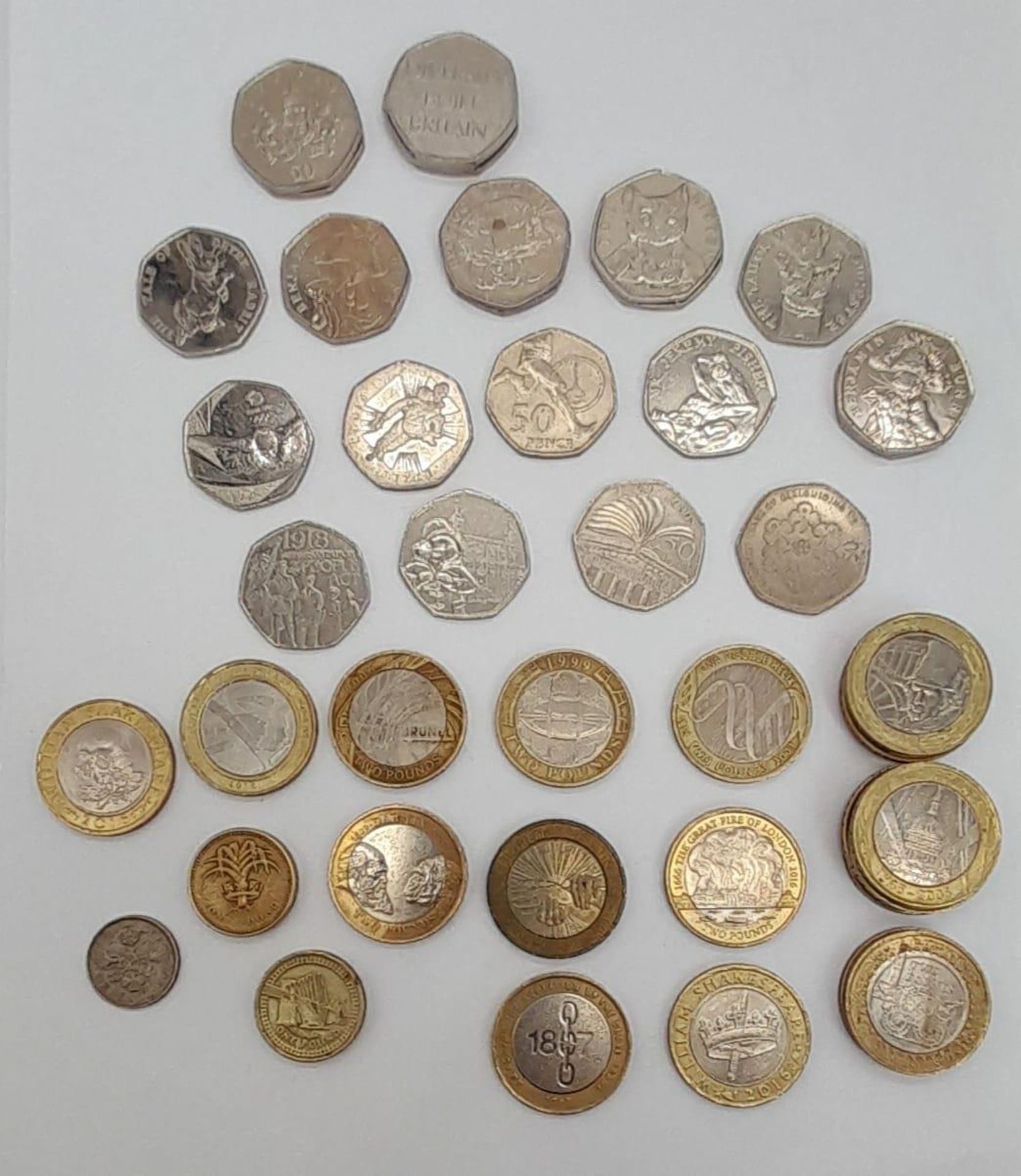 Collection of British coins of commemorative release. 22x £0.50, 19x £2, 2x £1 and one 1967 Six