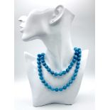 A Matinee Length Aquamarine Beaded Necklace. 10mm bead size. 84cm necklace length.