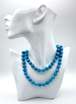 A Matinee Length Aquamarine Beaded Necklace. 10mm bead size. 84cm necklace length.