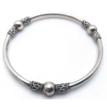 A fancy 925 silver bangle with diameter approx 7.5cm. Total weight 11.2G.