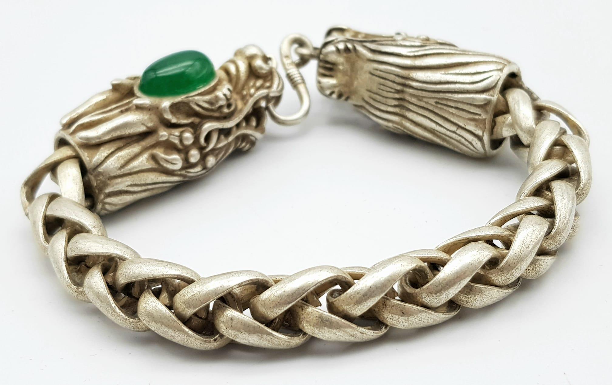 A Tibetan Silver and Green Jade Double Dragon Bracelet. Chinese dragon heads with jade cabochon - Image 3 of 5