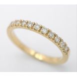 An 18 K yellow gold ring with a band of round cut diamonds, size: N, weight: 2.4 g.
