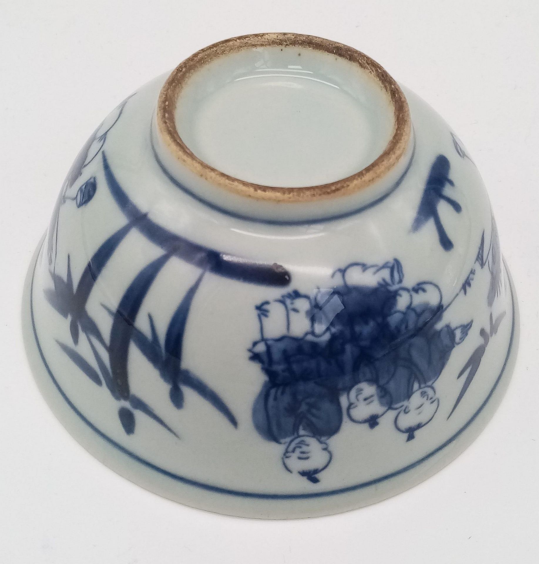 A Chinese blue and white hand painted bowl decorated with children playing with birds. White - Image 4 of 6