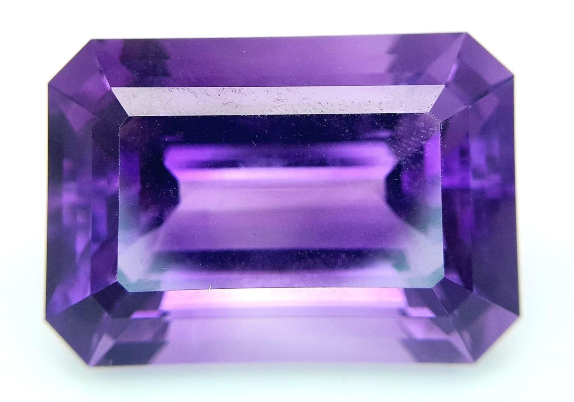 A large (92.03 carats), octagonal step cut AMETHYST, with excellent vivid and uniform colouration - Image 3 of 8