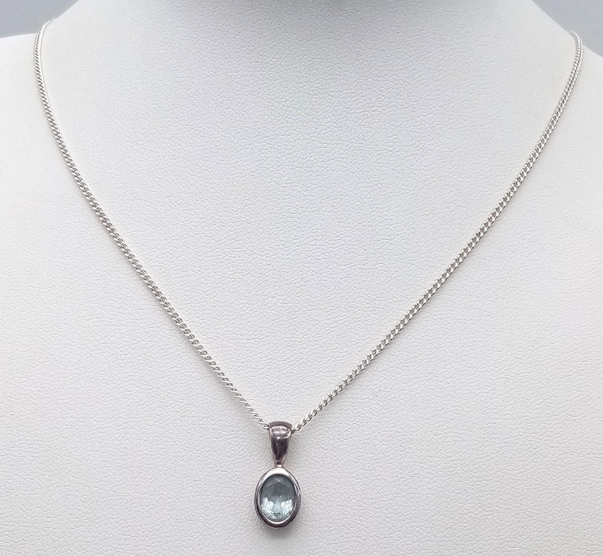 A Sterling Silver Blue Topaz Pendant on Chain. 1.8cm pendant, 46cm chain, 4.7g total weight. Ref: SC - Image 2 of 11