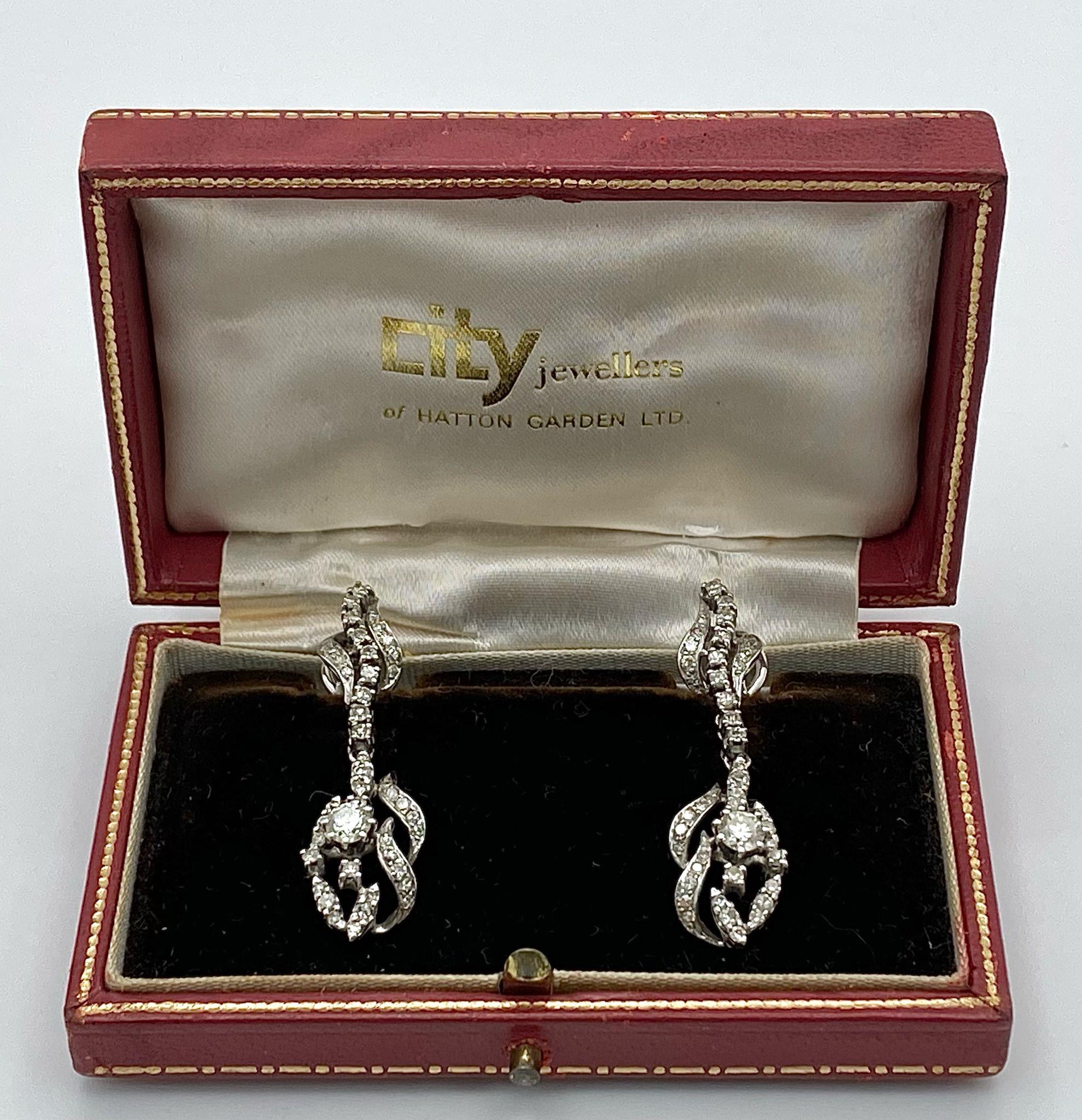 A Pair of Art Deco Style 18K White Gold and Diamond Drop Earrings. An array of round and brilliant - Image 12 of 15