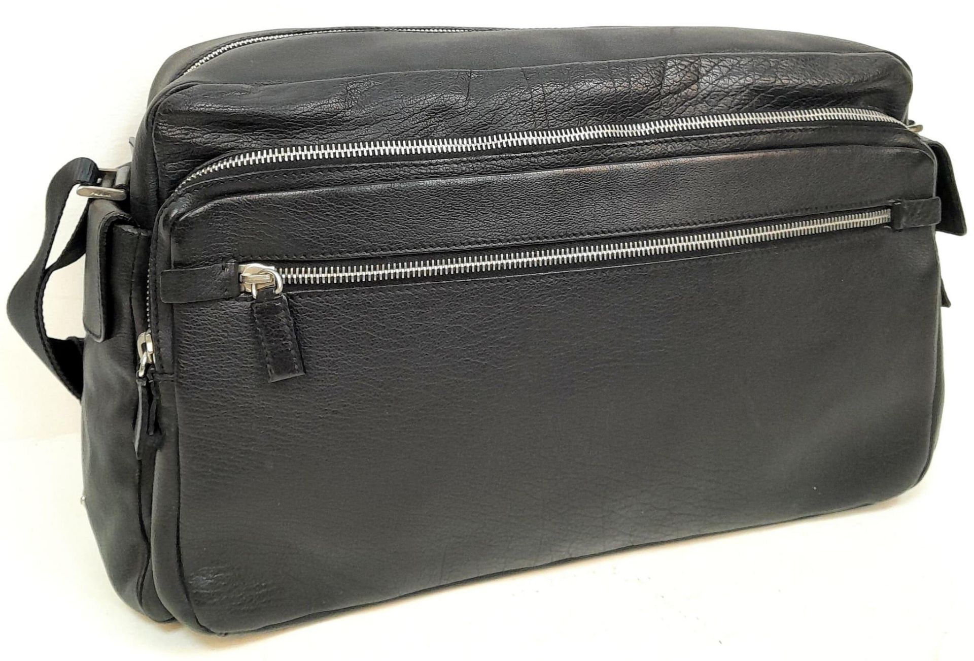 A Prada Black Duffle Bag. Leather exterior with silver-toned hardware, zipped outer compartment to - Bild 2 aus 12