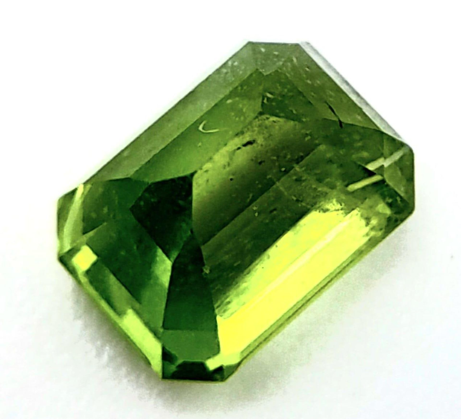 A 2.10ct Pakistan Natural Peridot Gemstone, Octagon shape. Comes with the GFCO Swiss Certificate. - Image 3 of 5