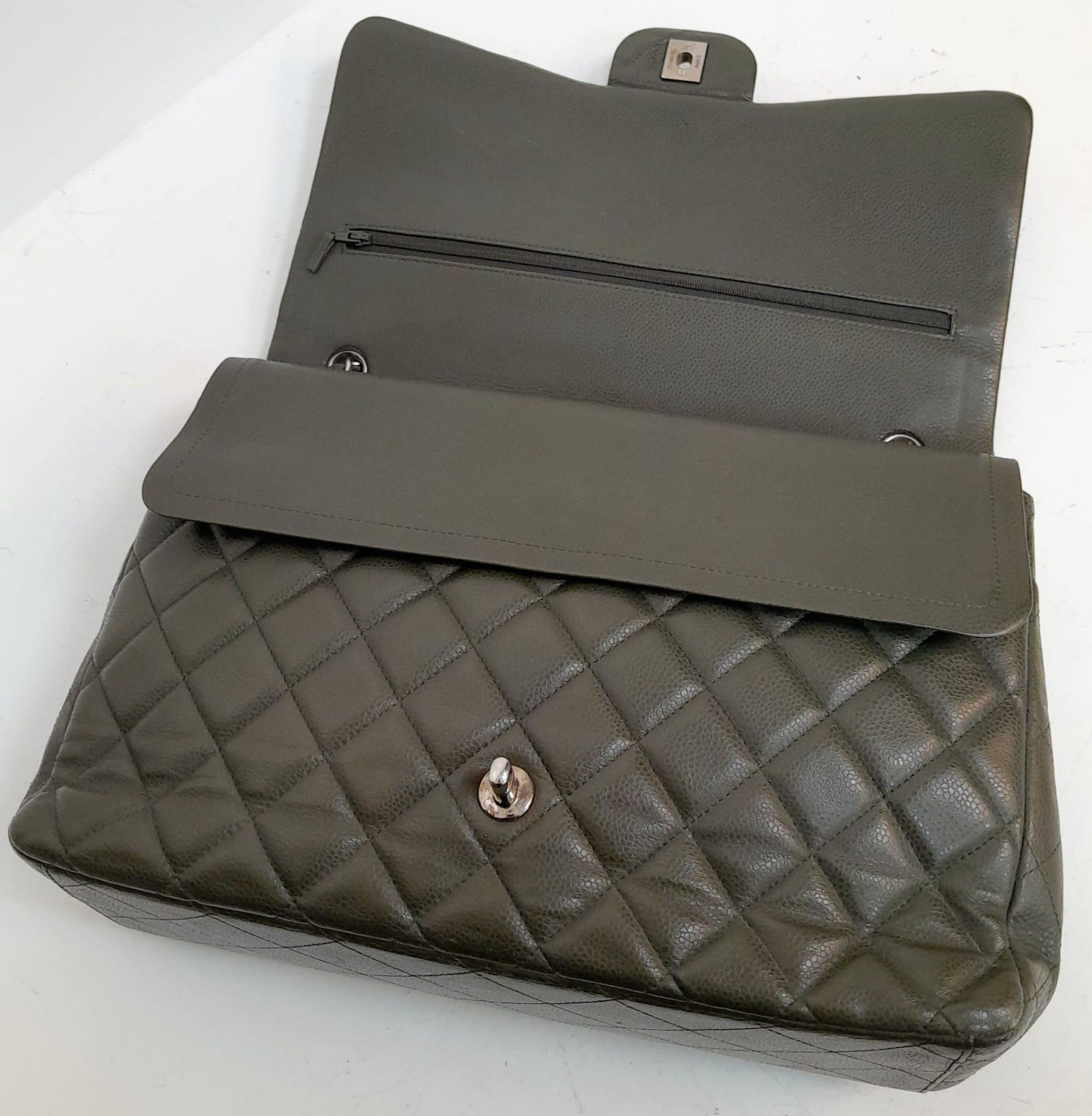 A Chanel Green Jumbo Classic Double Flap Bag. Quilted leather exterior with silver-toned hardware, - Image 5 of 14