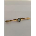 Vintage 9 carat GOLD and BLUE TOPAZ BAR BROOCH. Complete with original vintage case. 1.9 grams.