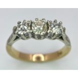 An Antique Three Stone Diamond Ring. 1.2ctw of old cut diamonds. Size L. 3.4g