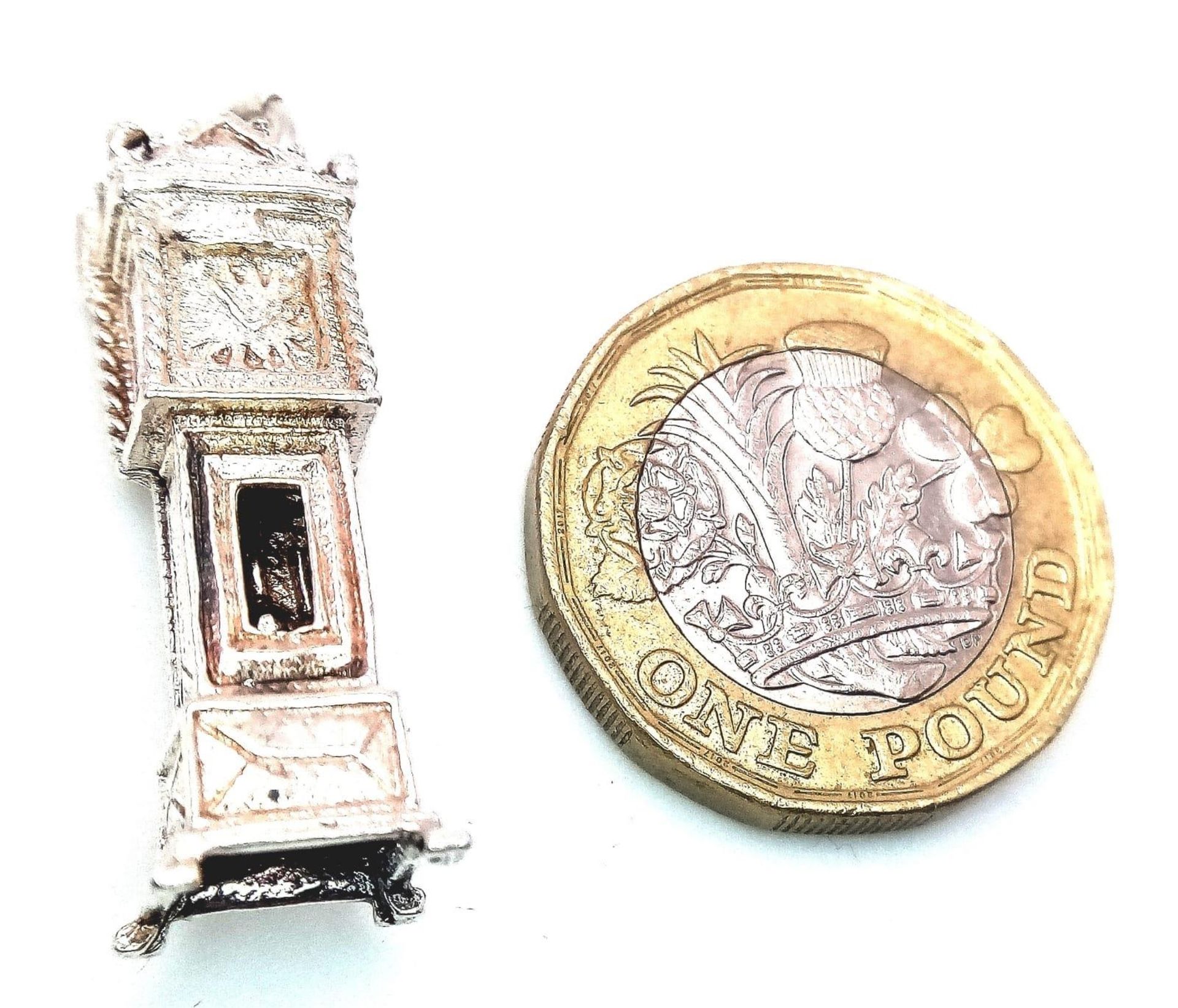 A Sterling Silver Grandfather Clock Charm, which Opens to Reveal the Movement. 3.2cm length, 4.5g - Image 4 of 7