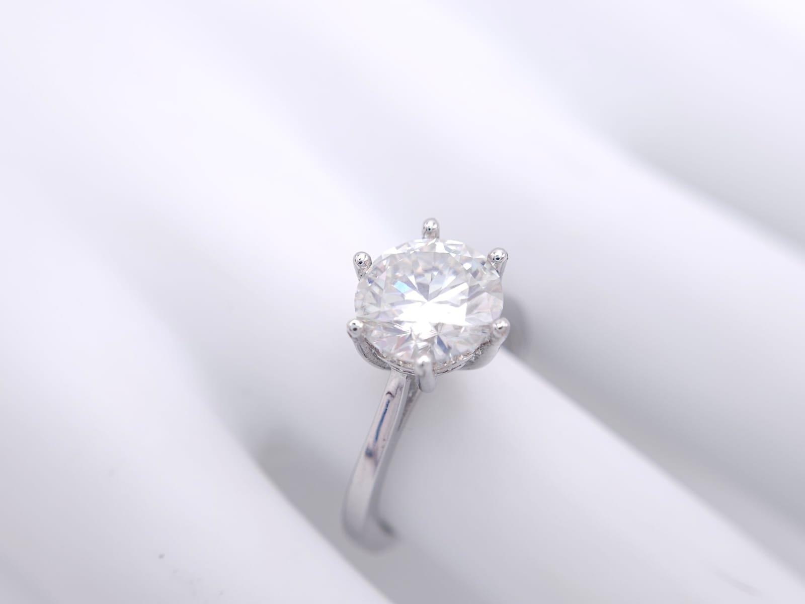 A sterling silver solitaire ring with a stunning round cut moissanite (3 carats), size: N, weight: - Image 10 of 13