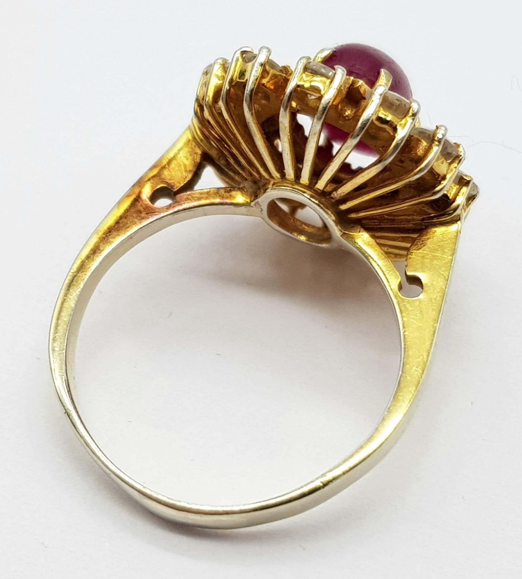 An 18K Gold (tested) Ruby and Diamond Ring. A 1.5ct high-grade ruby cabochon with a brilliant cut 12 - Image 3 of 6