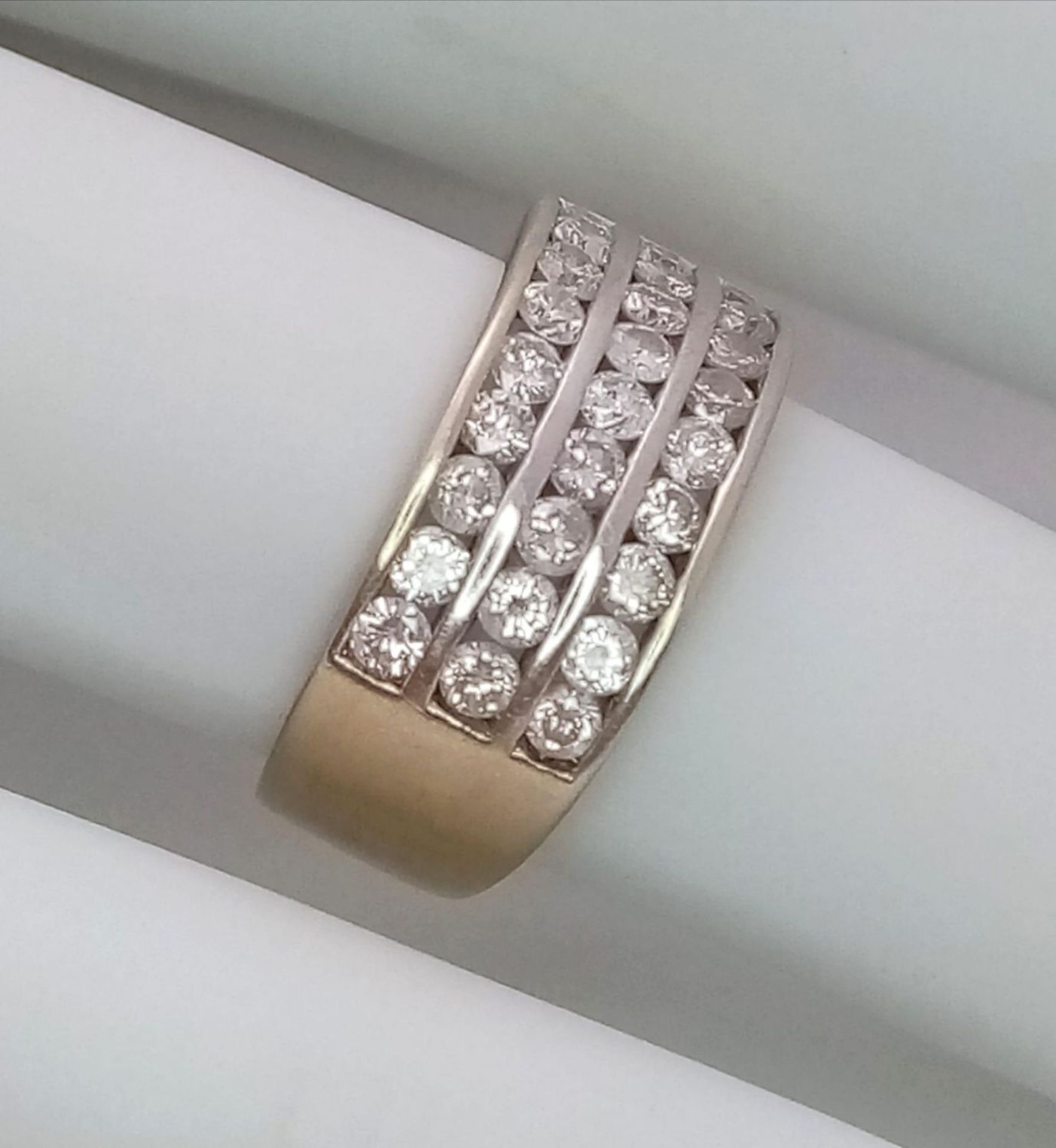 A well made 18 K yellow gold ring with three channels filled with round cut diamonds. Size: H, - Image 11 of 18