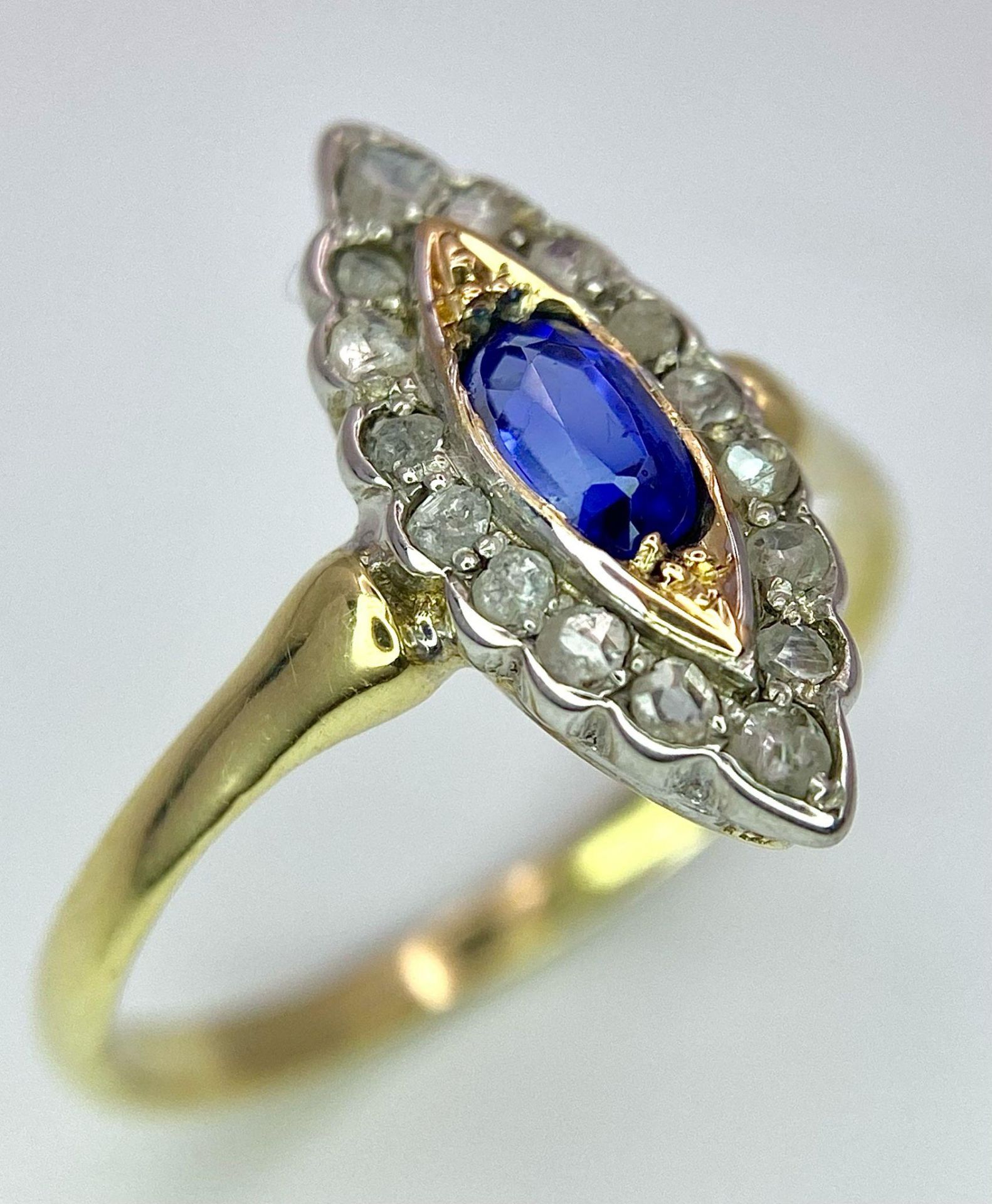 An 18K Yellow Gold Diamond and Sapphire Marquise Shaped Ring. Size M. 2.2g