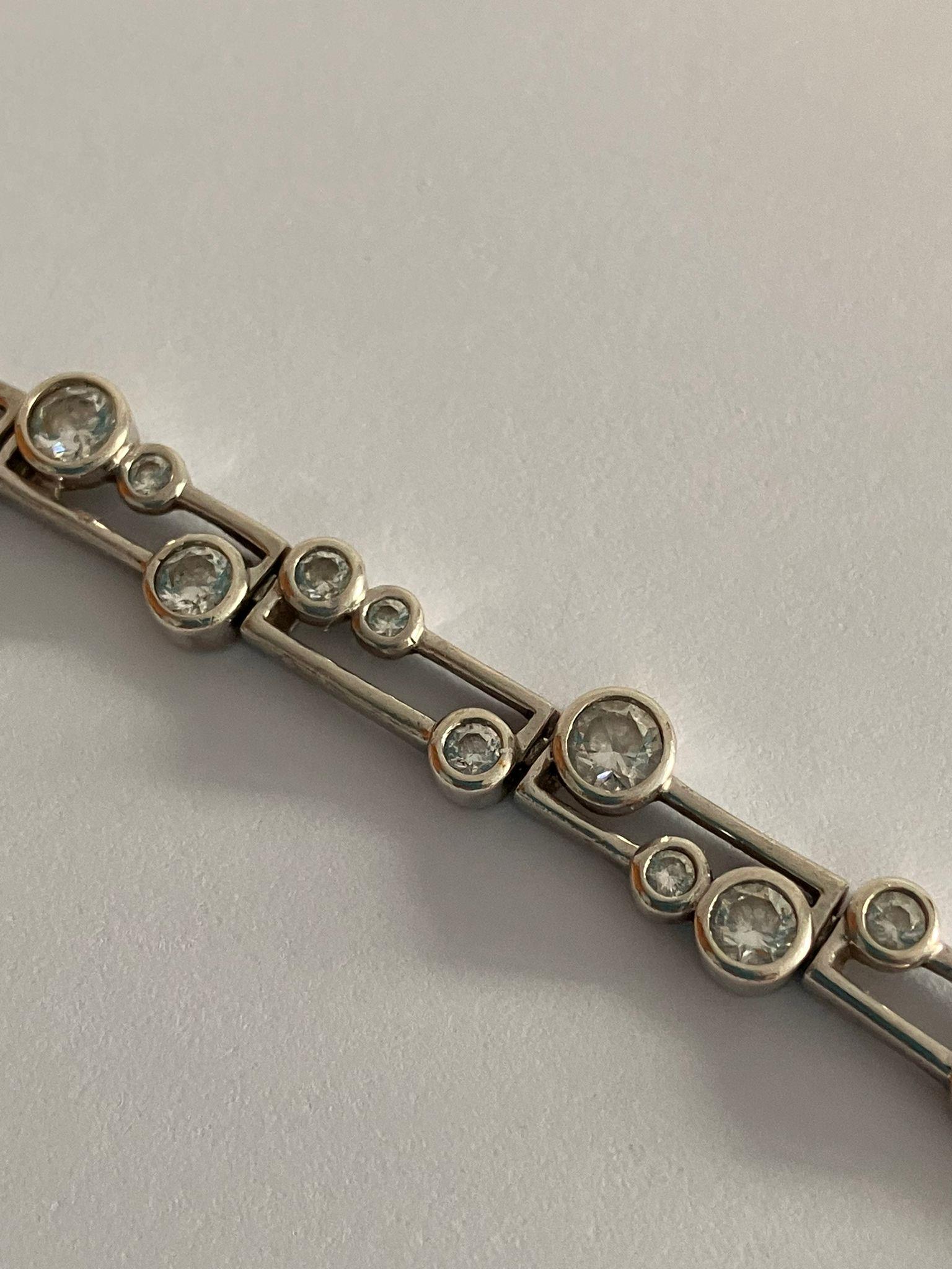 SILVER TENNIS BRACELET Set with sparkling cubic zirconia is in ‘Planet’ style. Full UK hallmark. - Image 3 of 3