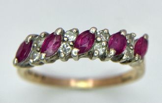 A 9K GOLD RUBY AND DIAMOND RING . 2.3gms size M