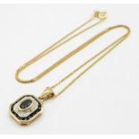 A 9K Yellow Gold Sapphire and Diamond Pendant on a 9K Yellow Gold Disappearing Necklace. Pendant -