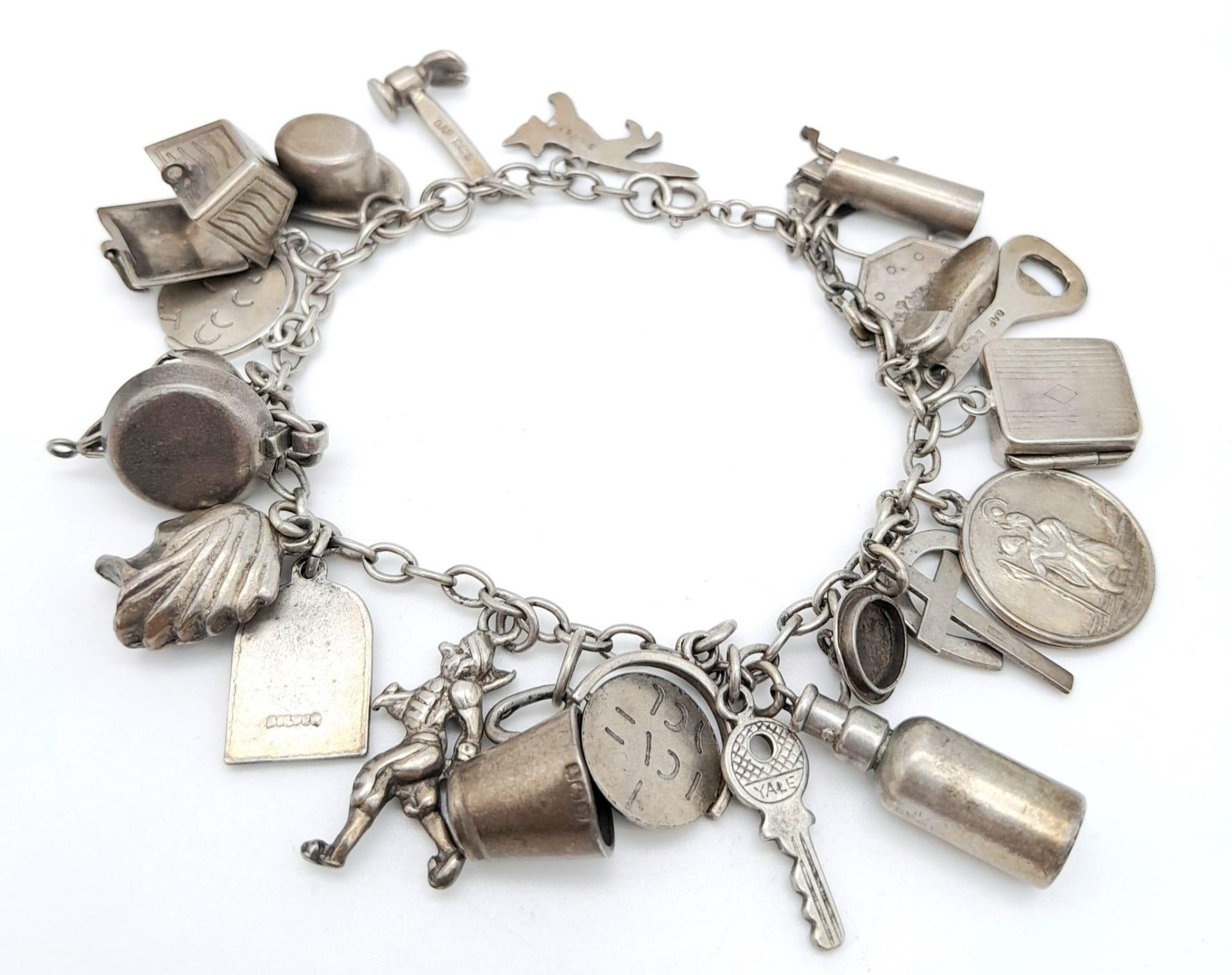 A Sterling Silver Charm Bracelet with 23 Charms. 18cm length, 48.5g total weight. Ref: SC 7088 - Image 2 of 5