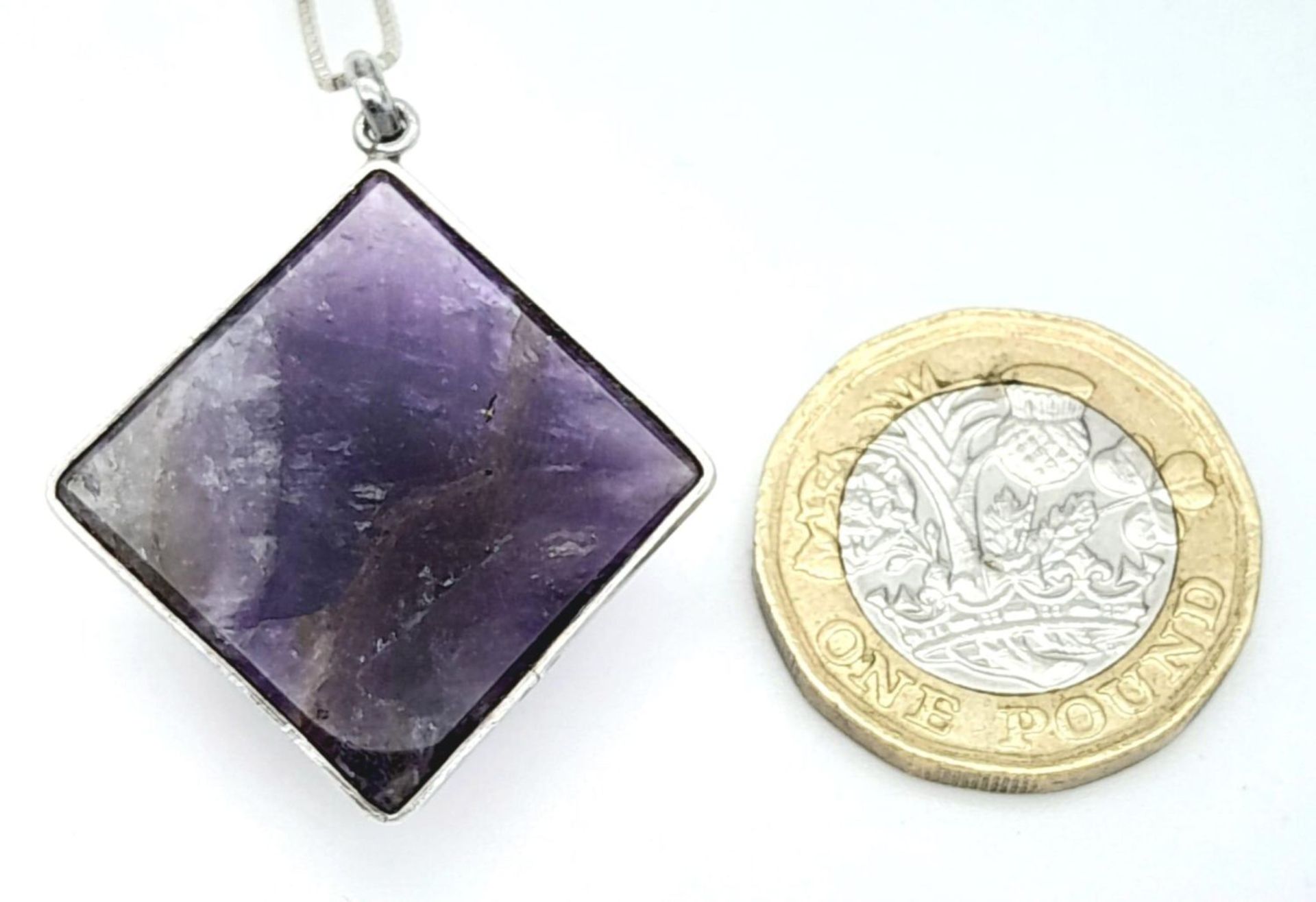 A Sterling Silver Pyramid Cut Amethyst Pendant Necklace. 37cm Length. Amethyst Measures 2cm Width. - Image 9 of 10