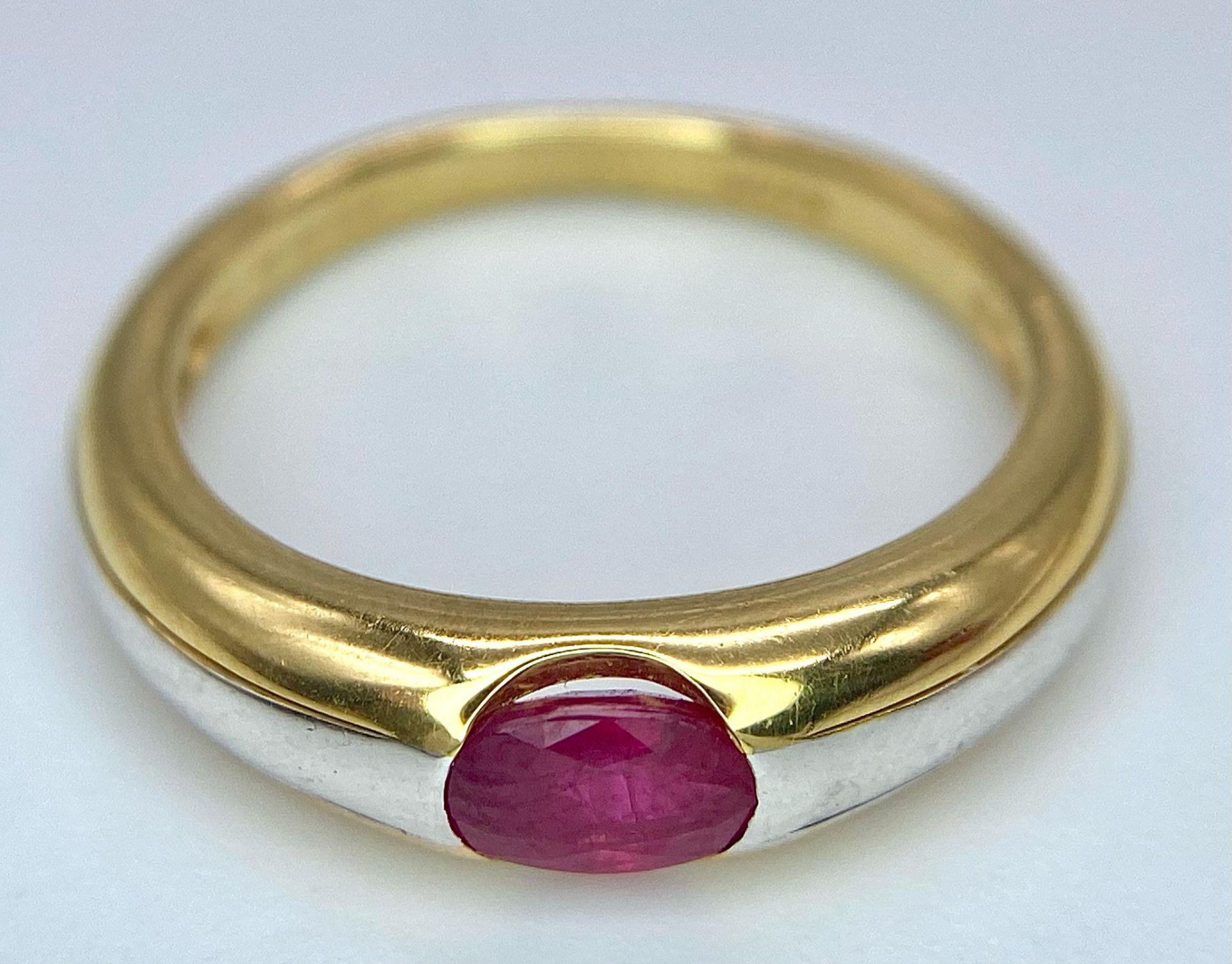 A 9K Yellow Gold Ruby Ring. Oval central ruby. Size N. 2.85g total weight. - Image 5 of 8