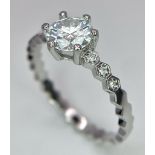 A sterling silver solitaire ring with a round cut moissanite (1 carat), size: Q1/2, weight: 2.2 g.