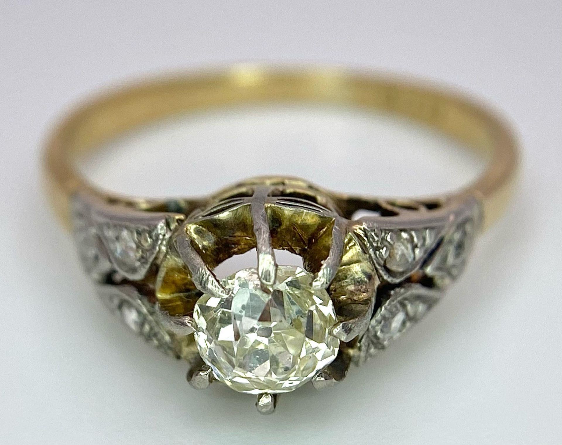 An Antique 18K Gold, Platinum and Diamond Ring. Central 0.75ct central stone with diamond accents on - Image 5 of 7