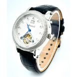 An Ingersoll Skeleton Automatic Gents Watch. Black leather strap. Stainless steel case - 37mm. White