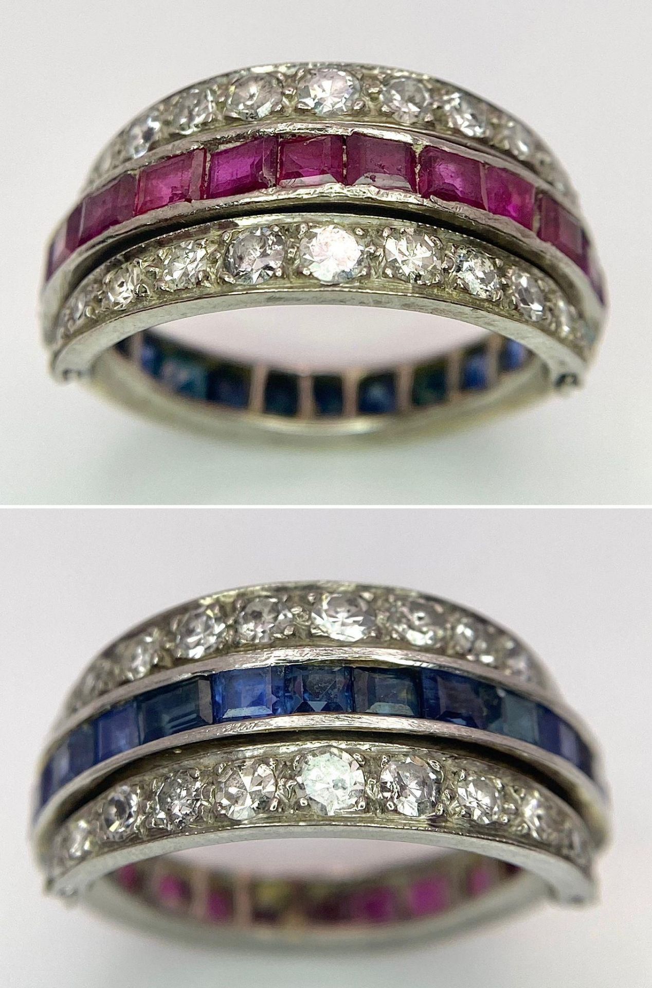 An 9k White Gold Sapphire, Diamond and Ruby Flip-Over Ring. A central band of rubies and sapphires