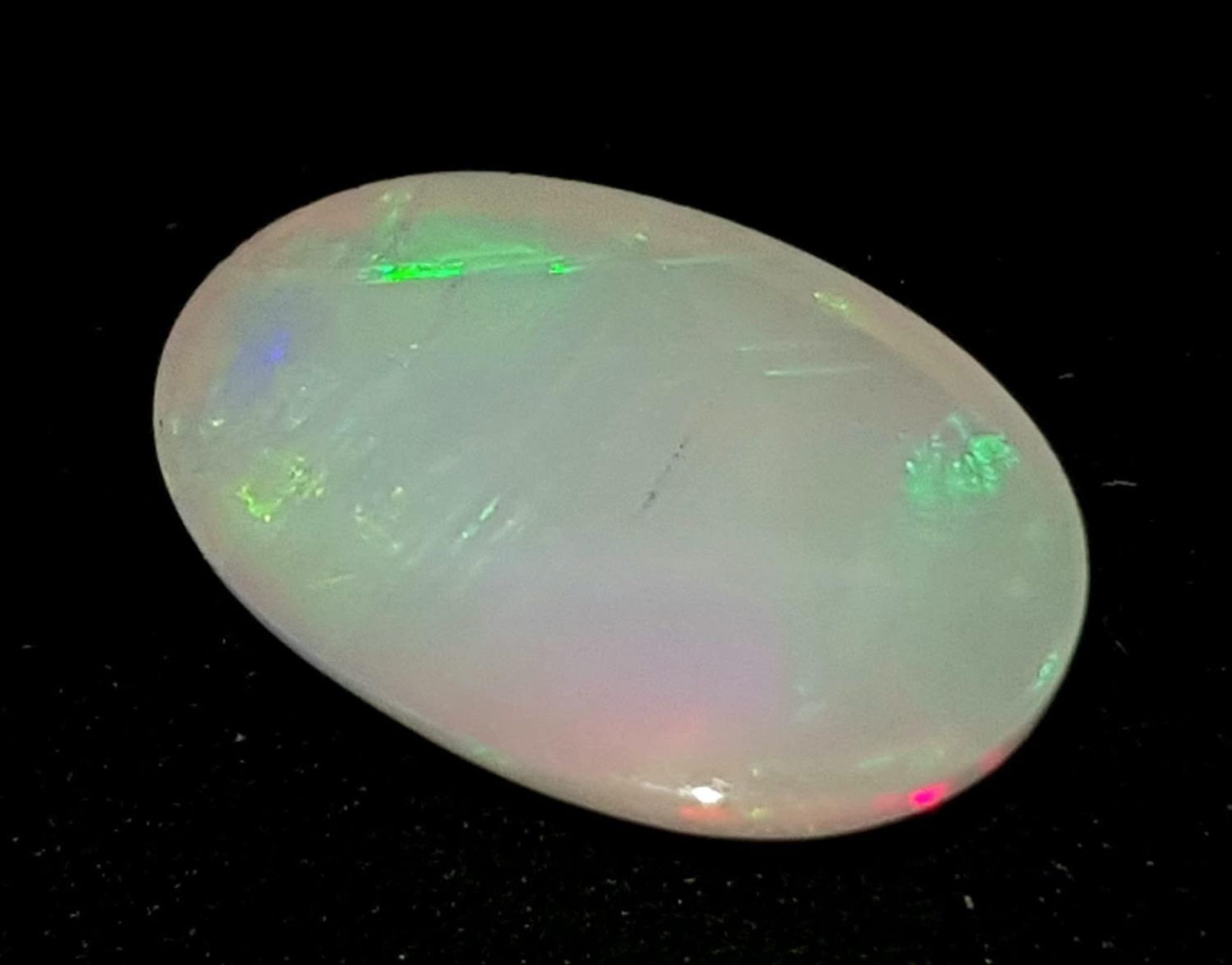 A 1.52ct Ethiopian Natural White Opal, in the Oval shape. Comes with the GFCO Certificate. ref: ZK - Bild 2 aus 6